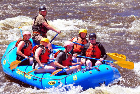 Image That Shows A Group of People Enjoying Adventurous Boat Ride..