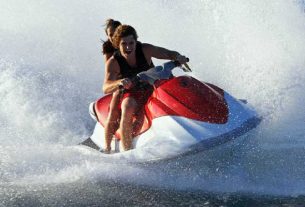 A Couple Enjoying Their Adventurous Water Biking Sport.