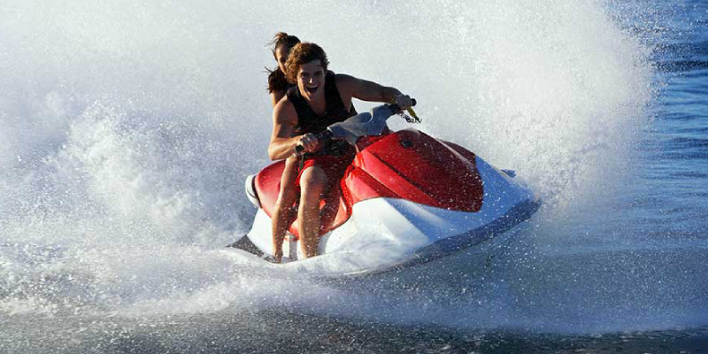 A Couple Enjoying Their Adventurous Water Biking Sport.