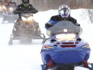 An Image of A Biker Riding On Snow.