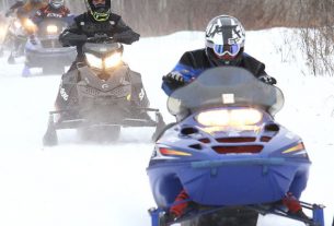 An Image of A Biker Riding On Snow.