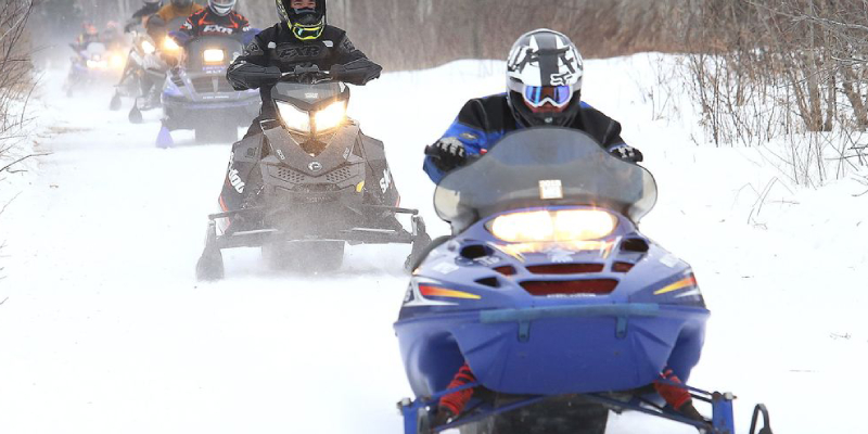 An Image of A Biker Riding On Snow.