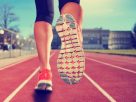 A Close-up View Of A Man's Boots During His Jogging On A Sunny Day.