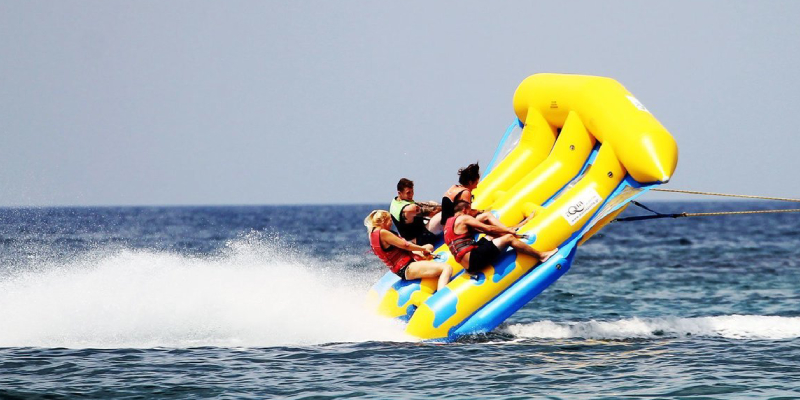 Happy People Having Fun On Water Boats In The Sea.