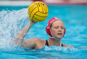 A Female Water Polo Player In An Action.