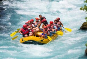 Group of People Having Fun During River Rafting.