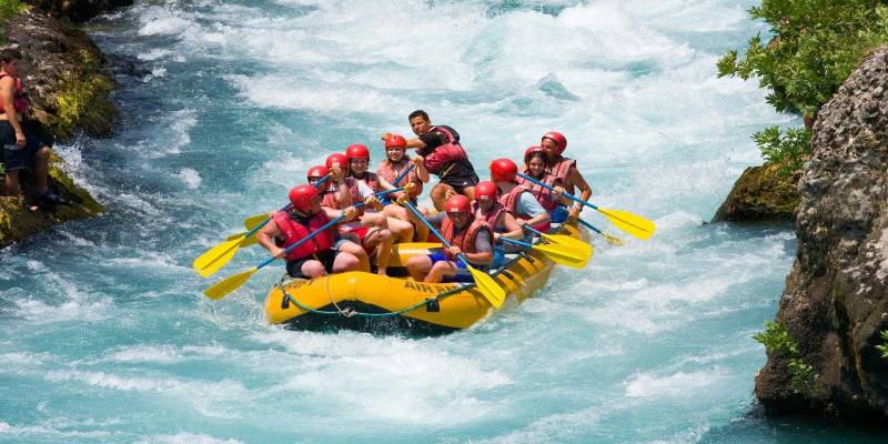 Group of People Having Fun During River Rafting.