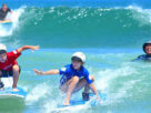 Children Enjoying Skating In The Beach.