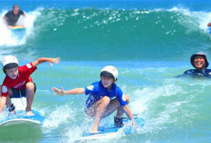 Children Enjoying Skating In The Beach.