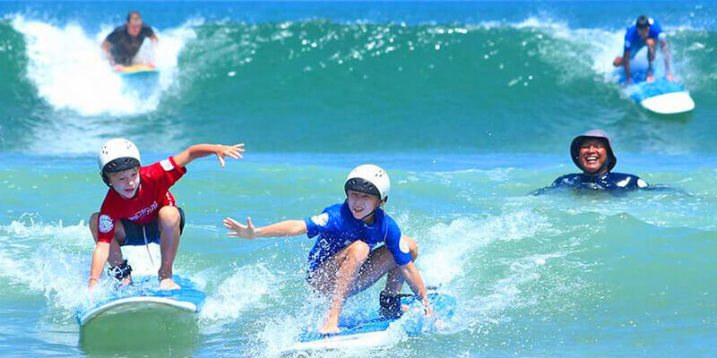 Children Enjoying Skating In The Beach.