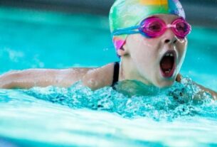 A Small Girl Image While Swimming.