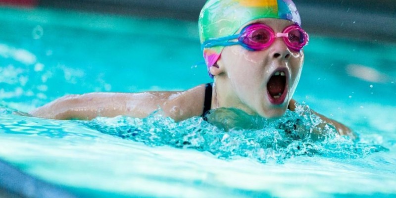 A Small Girl Image While Swimming.