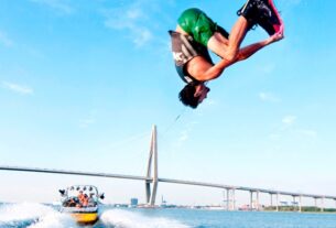 An Image Representing Flyboarding of A man.