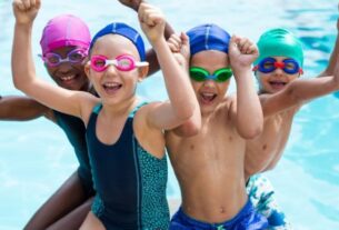 Cute Little Boys Enjoying While Swimming.