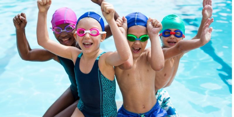 Cute Little Boys Enjoying While Swimming.