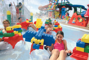 Group of Kids Playing With Water Toys.