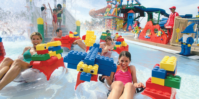 Group of Kids Playing With Water Toys.