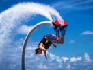 An Image Representing Flyboarding of A man.