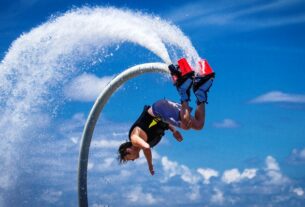 An Image Representing Flyboarding of A man.