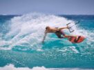 A man Enjoying Skateboarding In The Sea.