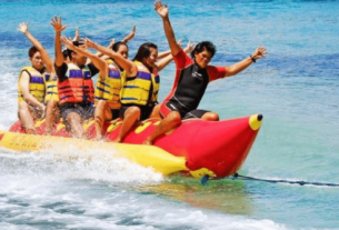 A Group of Fun People Playing In The Beach.