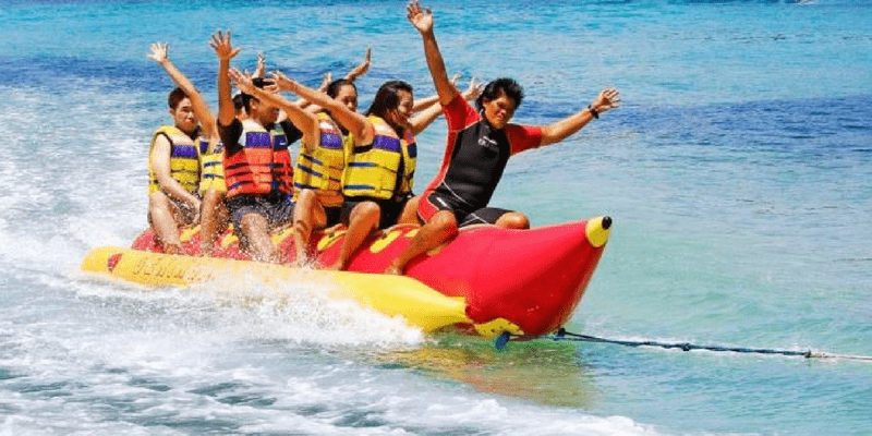 A Group of Fun People Playing In The Beach.