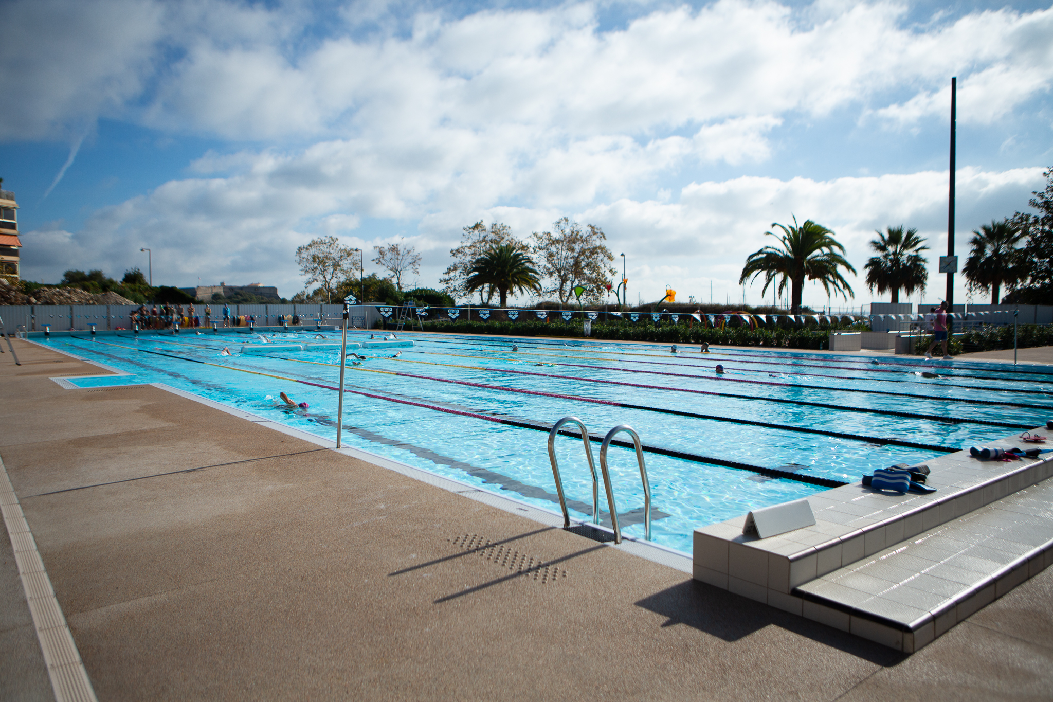 A public swimming pool with swimmers